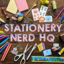 A banner that says 'STATIONERY NERD HQ' with stationery items surrounding it